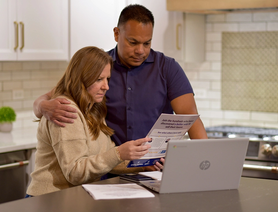 Family reviewing paperwork for an inherited house sale